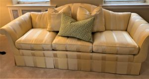 yellow striped satin sofa for home staging